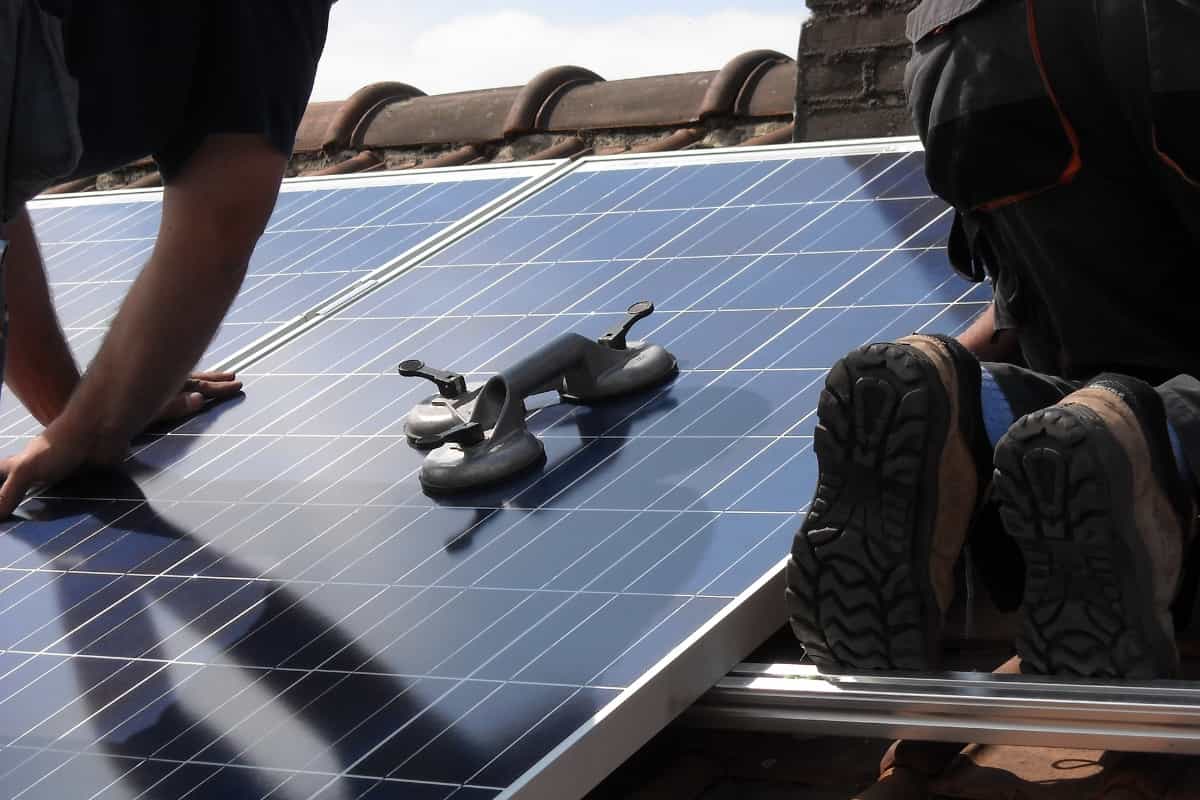 Man installing a solar panel
